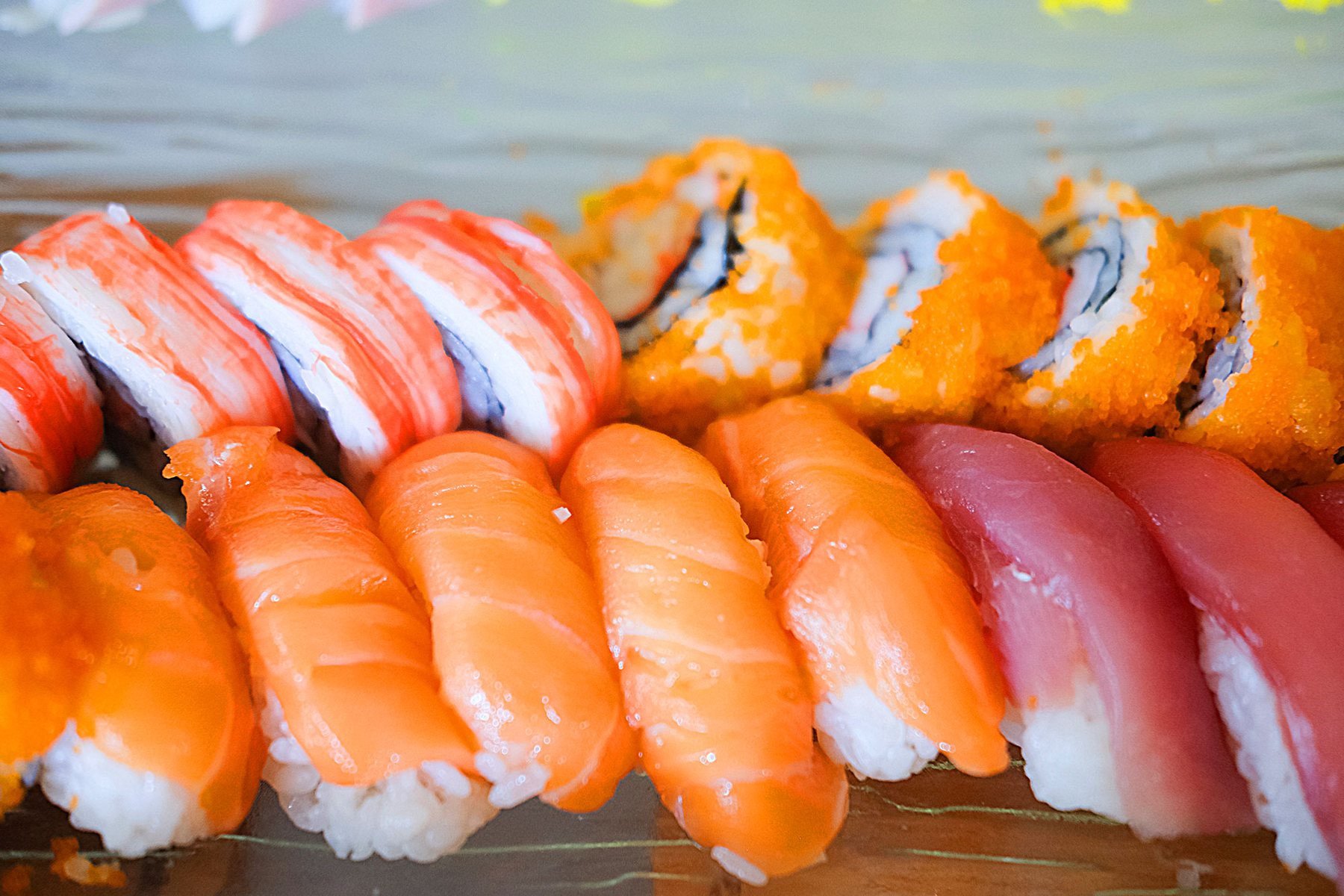 Fresh salmon and tuna nigiri with sushi rolls